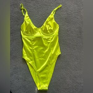 Neon yellow bodysuit.